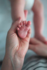 Low section of baby feet