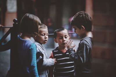 Boy playing with arms raised