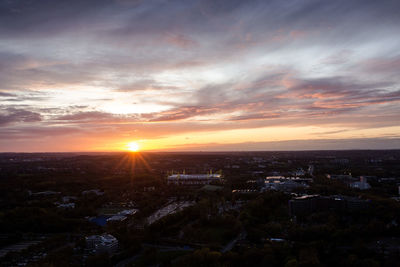 High angle view of buildings against sky during sunset