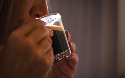 Close-up of man holding mobile phone