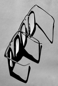 High angle view of eyeglasses on table against wall