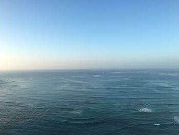 Scenic view of sea against blue sky