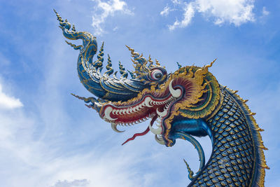 Low angle view of statue against sky