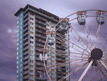 Low angle view of ferris wheel against sky, follonica