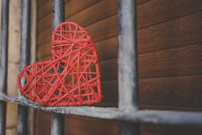 Close-up of heart shape on iron grill