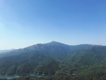 Scenic view of mountains against clear blue sky