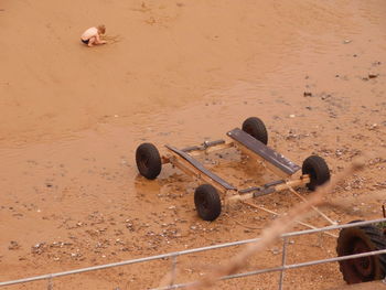 High angle view of rusty chain on sand