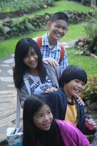 Cheerful siblings in park