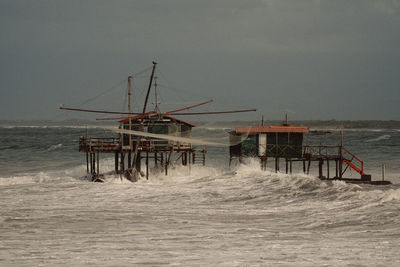 Pier on sea against sky