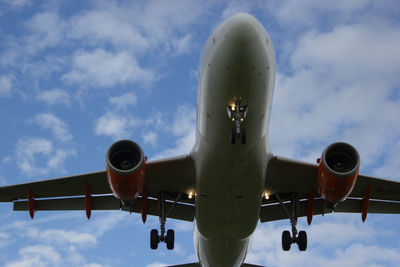 Low angle view of airplane against the sky