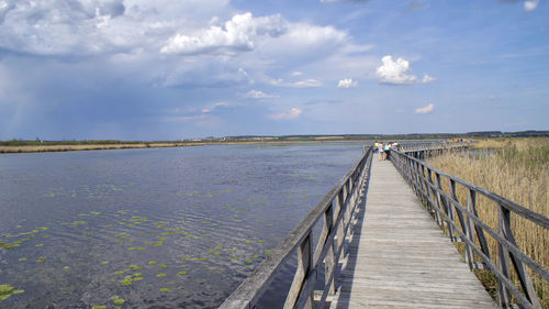 Pier over sea against sky