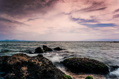 Scenic view of sea against cloudy sky