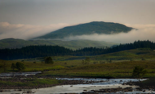 Scenic view of landscape and mountains against sky