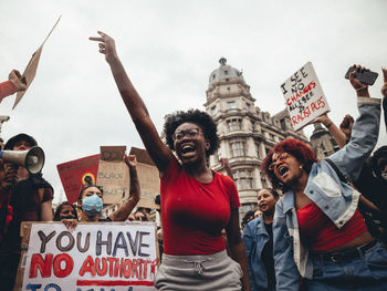 GROUP OF PEOPLE STANDING AGAINST THE SKY