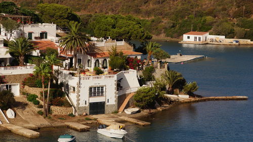 High angle view of houses by lake