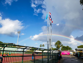 Low angle view of flag against blue sky