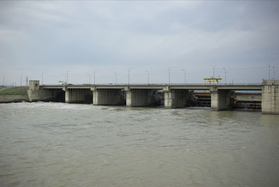 Bridge over sea against sky