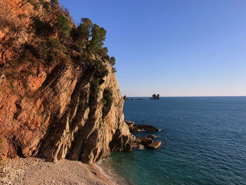 Scenic view of sea against clear blue sky