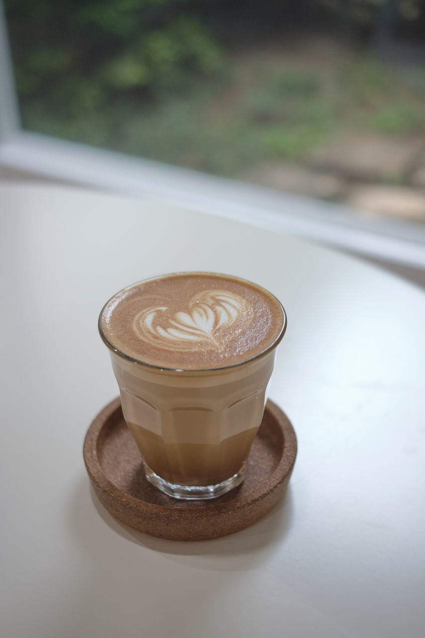 CLOSE-UP OF COFFEE CUP WITH SPOON