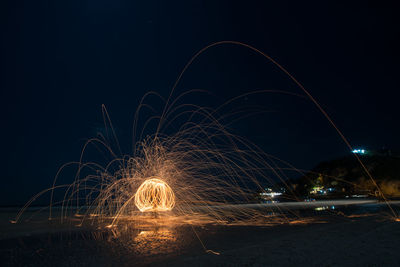 Light trails against sky at night