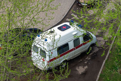 High angle view of abandoned car on field