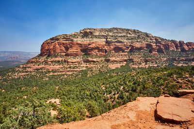 Rock formations on mountain against sky