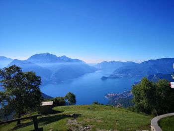 Scenic view of mountains against clear blue sky