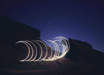 Light painting against sky at night