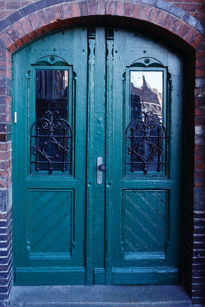 CLOSED DOOR OF WINDOW OF OLD BUILDING