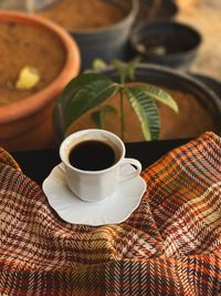 High angle view of coffee cup on table