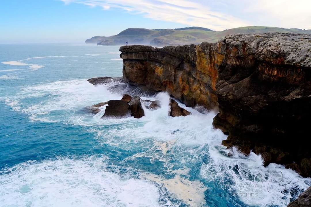 rock formation, rock - object, nature, sea, water, beauty in nature, motion, scenics, rock, wave, no people, sky, day, outdoors, cliff, horizon over water, power in nature, force