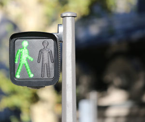Close-up of sign on road