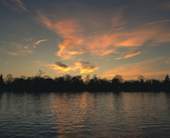 Scenic view of lake against sky during sunset