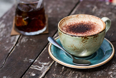 Close-up of cappuccino cup on table