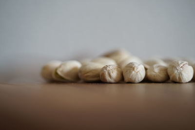 Close-up of eggs on table against white background