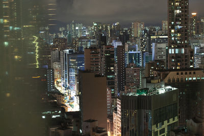 Illuminated buildings in city at night