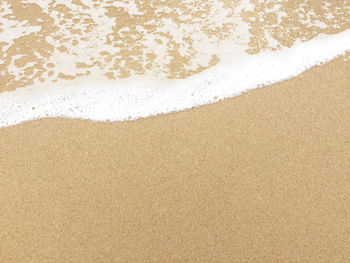 High angle view of coffee on beach