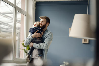 Father spending time with his son at home