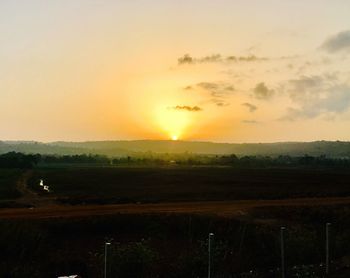 Scenic view of landscape during sunset