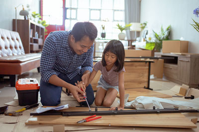 Side view of man working in workshop