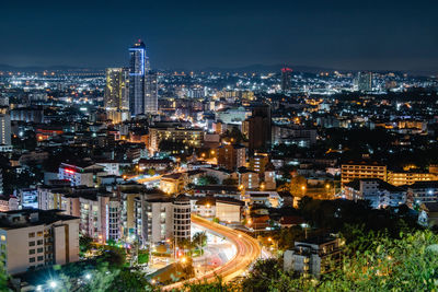 High angle view of illuminated buildings in city at night