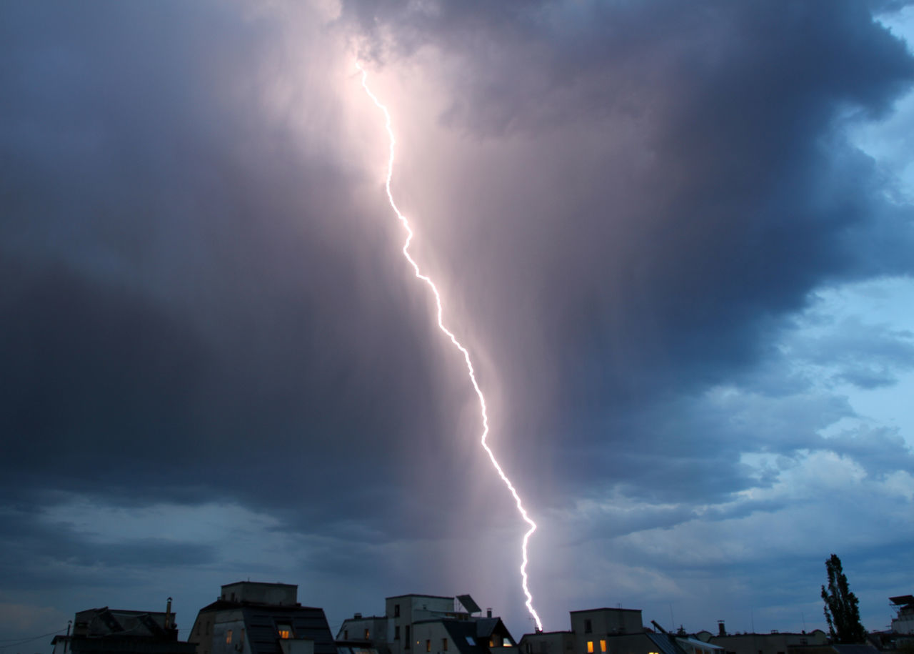 LOW ANGLE VIEW OF LIGHTNING OVER STORM CLOUDS