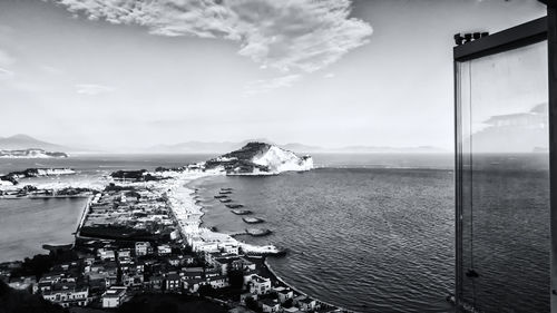 Panoramic view of sea and buildings against sky