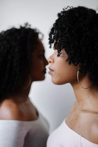 Two beautiful african women opposite each other portrait