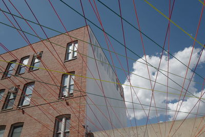 Low angle view of building against blue sky