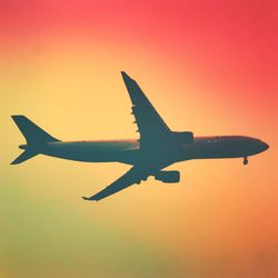 Low angle view of airplane flying in sky