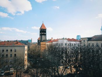 Church in city against sky