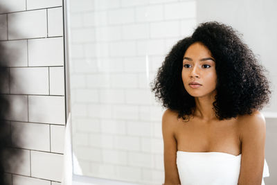 Close-up of young woman reflecting on mirror