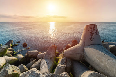 Scenic view of sea against sky during sunset