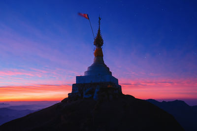 Low angle view of building against sky during sunset